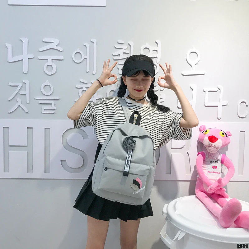 

2018 New Canvas Wool Ball High Capacity Backpack Korean Style New Letter Printing Schoolbag Collision Color Women