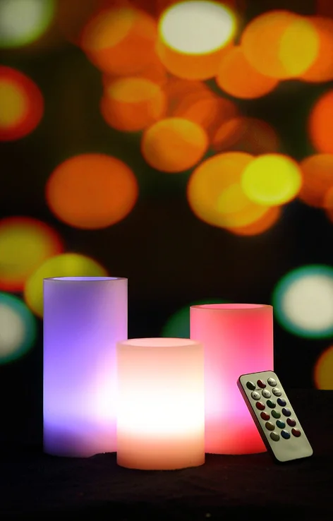 Battery Operated LED Flameless Candles - Set of 3 Round Ivory Wax with Flickering Multi Colored Flame |