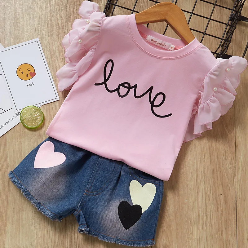 

2019 summer hot girl pearl flying sleeve letter LOVE short-sleeved T-shirt + denim shorts suit love two-piece girl's clothes