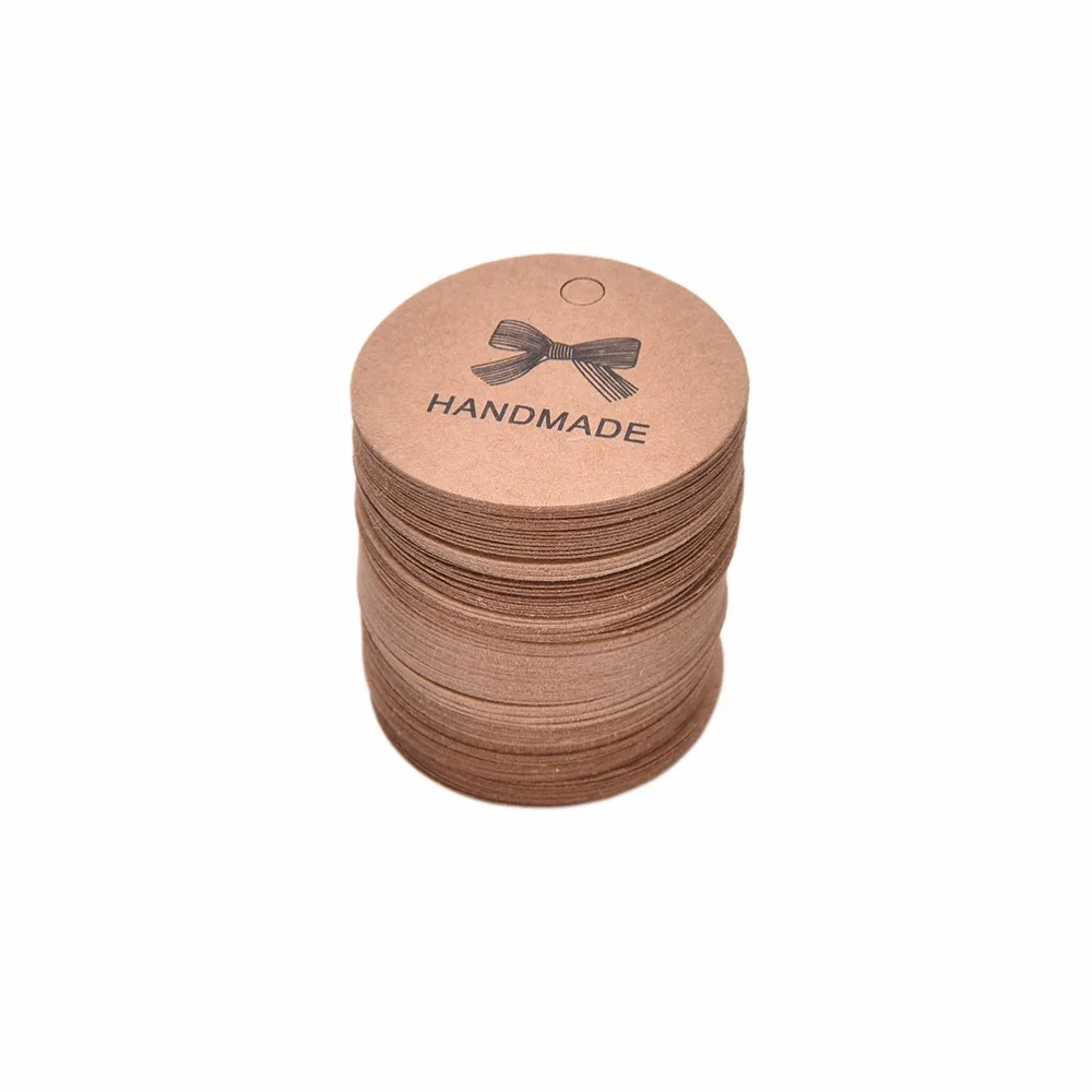 

100pcs/lot Bowknot Kraft labels Handmade Label DIY Vintage Label Hand Made For Gift Cake Baking Sealing Hang tag Brown Garment