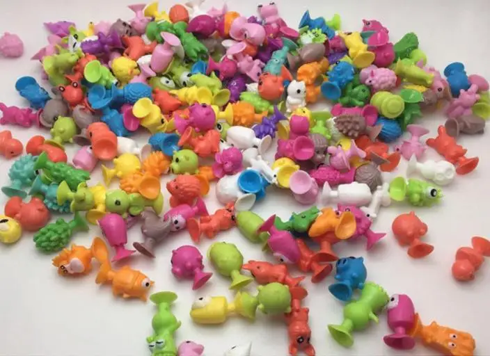 

20pcs/ The latest styles of small monsters, sucker dolls, cartoon aliens model toys