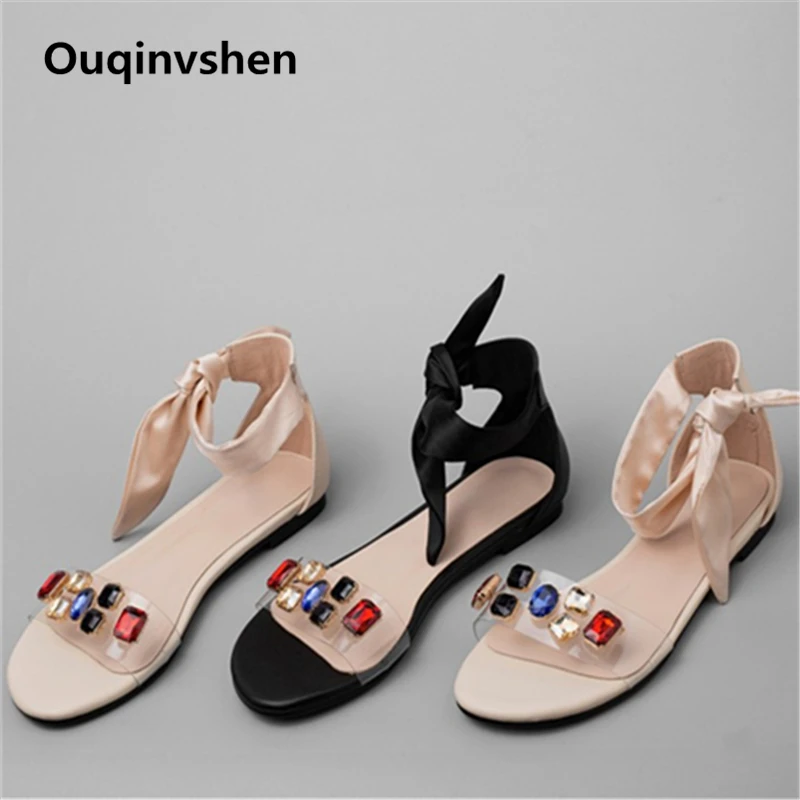 

Ouqinvshen Butterfly-knot Flat Sandals Women Casual Crystal Peep Toe Summer Shoes Women Transparent Mixed Colors Lace Up Sandals