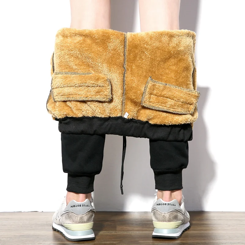 

2019 winter new men's plus velvet padded trousers Slim large size warm feet trousers solid color trend sports pants M-5XL