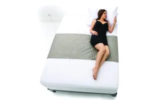 1200x1200_plush_silver_sleep_pad_model_on_bed_small_horizontal