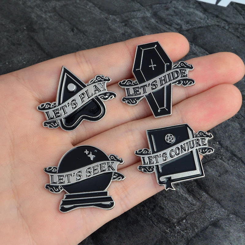 

QIHE JEWELRY Let's conjure, seek, hide, and play Enamel pins Heart Coffin Magic spell Pins Brooches Badges Lapel pin Halloween
