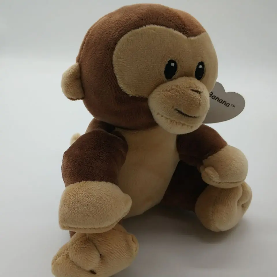 stuffed toy monkey with banana