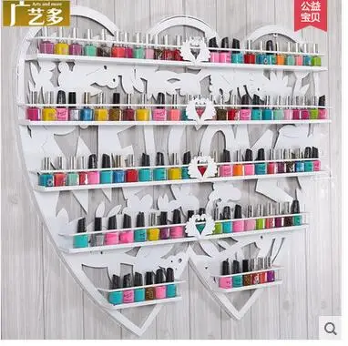 

Iron art wall hung a heart-shaped cosmetics shelf to display the receiving cabinet