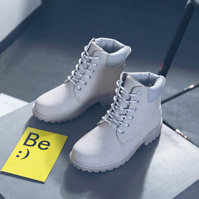 

Fashion women's spring and autumn and winter flat Martin boots leather boots couple short boots.