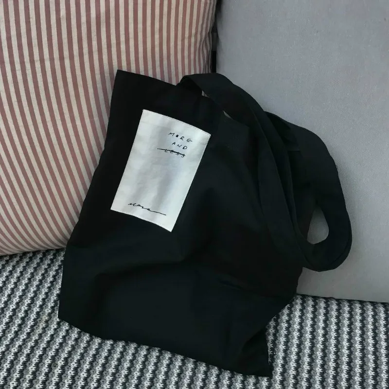 أسود ايكو ضئيلة قماش النساء رسول واحد الكتف Crossbody حقيبة الفتيات كبيرة للمتسوقين حقائب مضحك الشاطئ طوي التسوق اليد