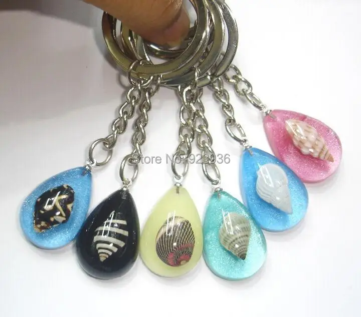 

FREE SHIPPING 12 PCS Real sea snail Seashell inside Mix Cute Colorful Cool Keychain For Promotion Gift,novel gift,novel souvenir