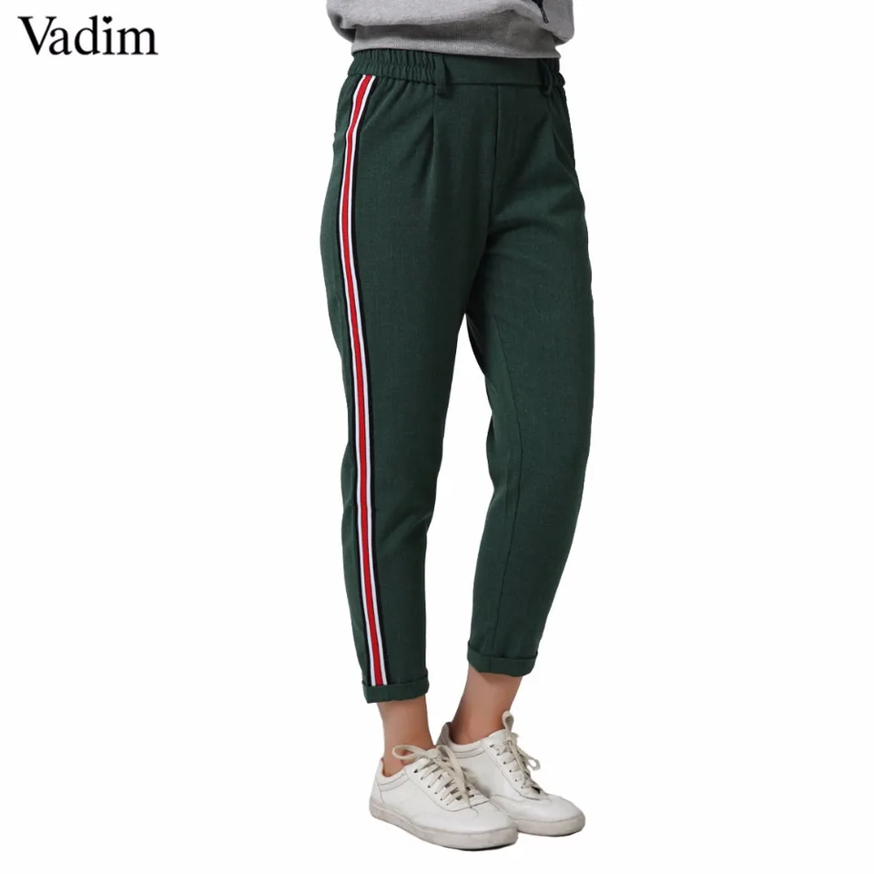 black pants with green side stripe