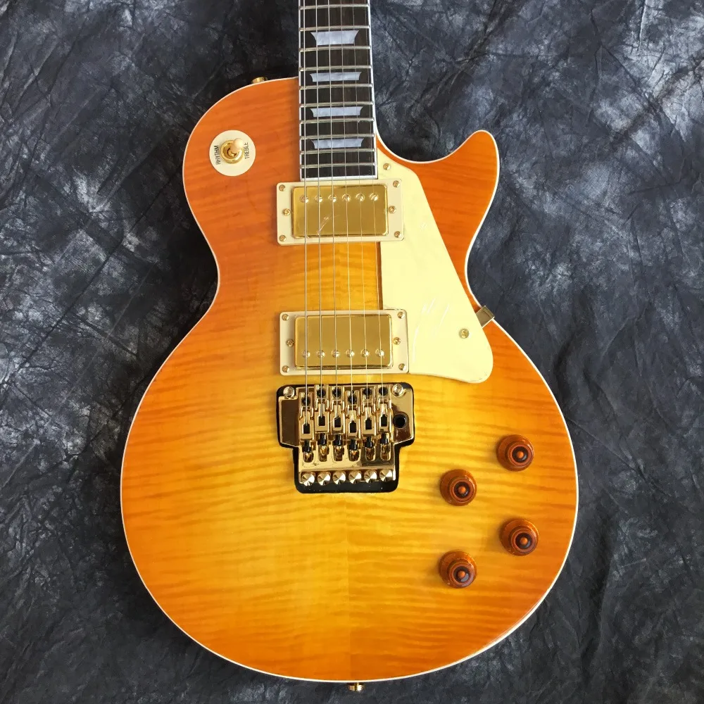 

2019 wholesale and retail new golden vibrato guitar electric guitar high quality good sound quality free shipping