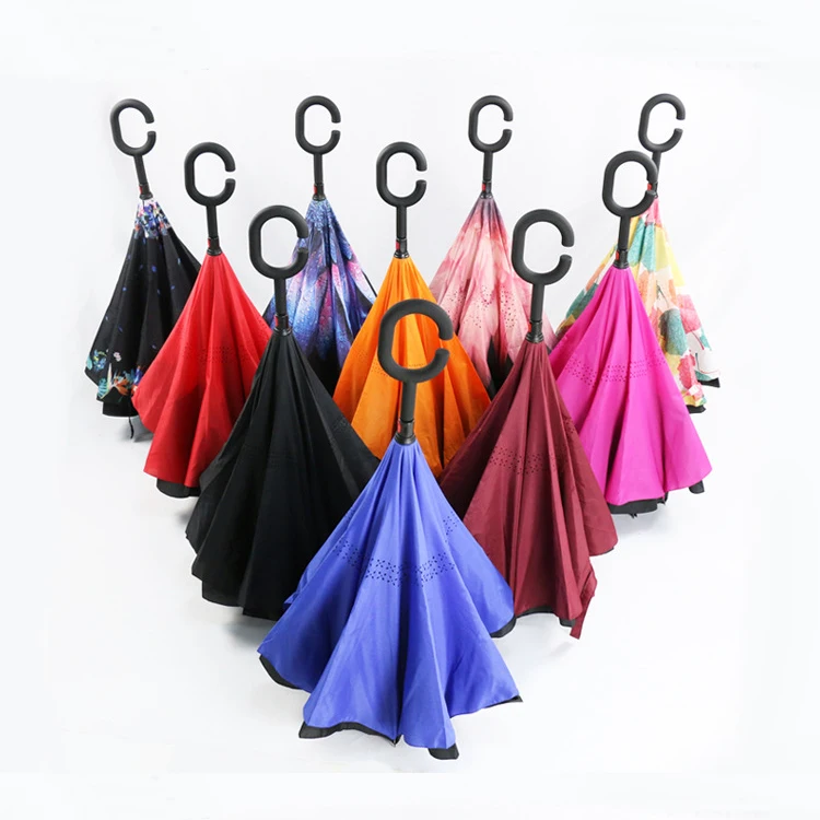 

The new creative c-type no-holding type can stand upright double car umbrella with an umbrella