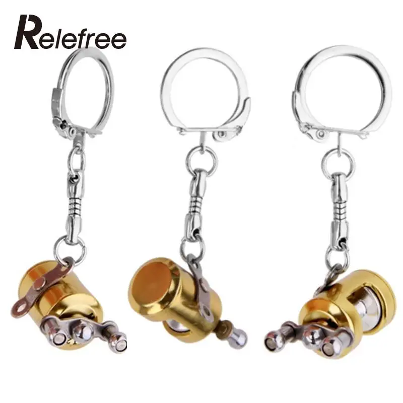 Livraison gratuite 2 pièces/lot moulinet à mouche et moulinet de pêche à la traîne doré porte-clés porte-clés accessoires de pêche (lot de 2)