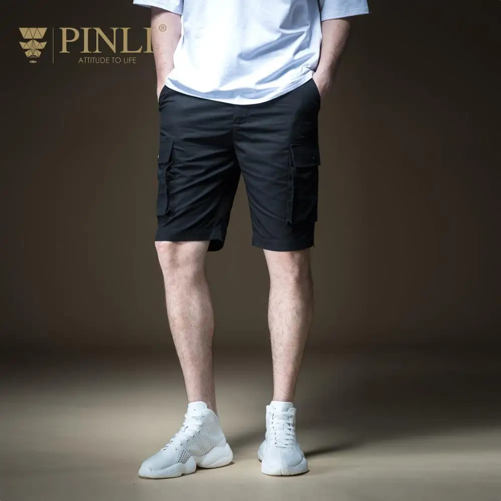 Прибытие Masculino Фитнес Мужчины Pinli лето мужской прямой цилиндр Спецодежда брюки мульти-мешок досуг короткие B192217598