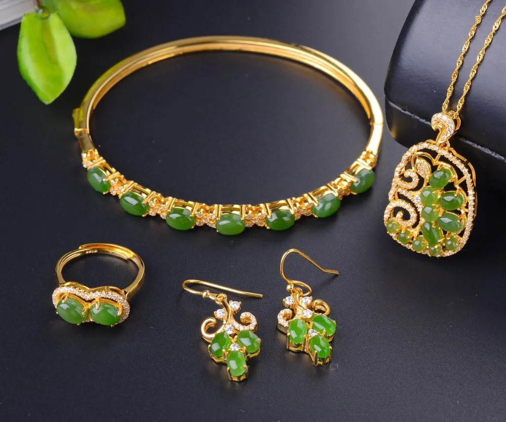 

Natural Hetian jade jewelery pendant bracelet earrings four sets 925 silver inlaid gold live mouth