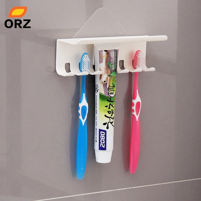 ORZ فرشاة الأسنان حامل جدار جبل سحرية ملصقا الحمام الأسرة فرشاة أسنان مجموعة جدار حامل معجون الأسنان وضع تخزين حامل رف