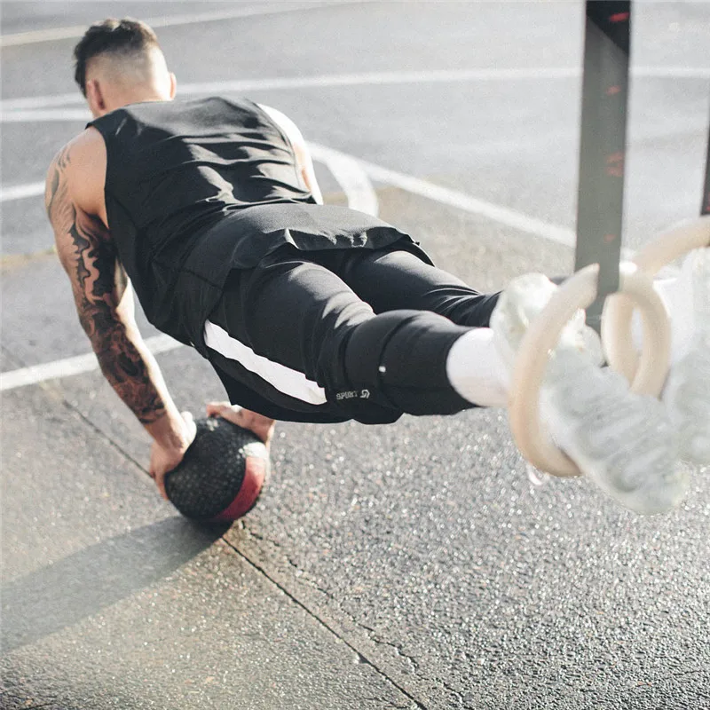 YEMEKE 2018 осенью новый высокое качество Jogger модные штаны Для мужчин Фитнес Бодибилдинг тренажерные залы брюки бегунов брендовая одежда брюки