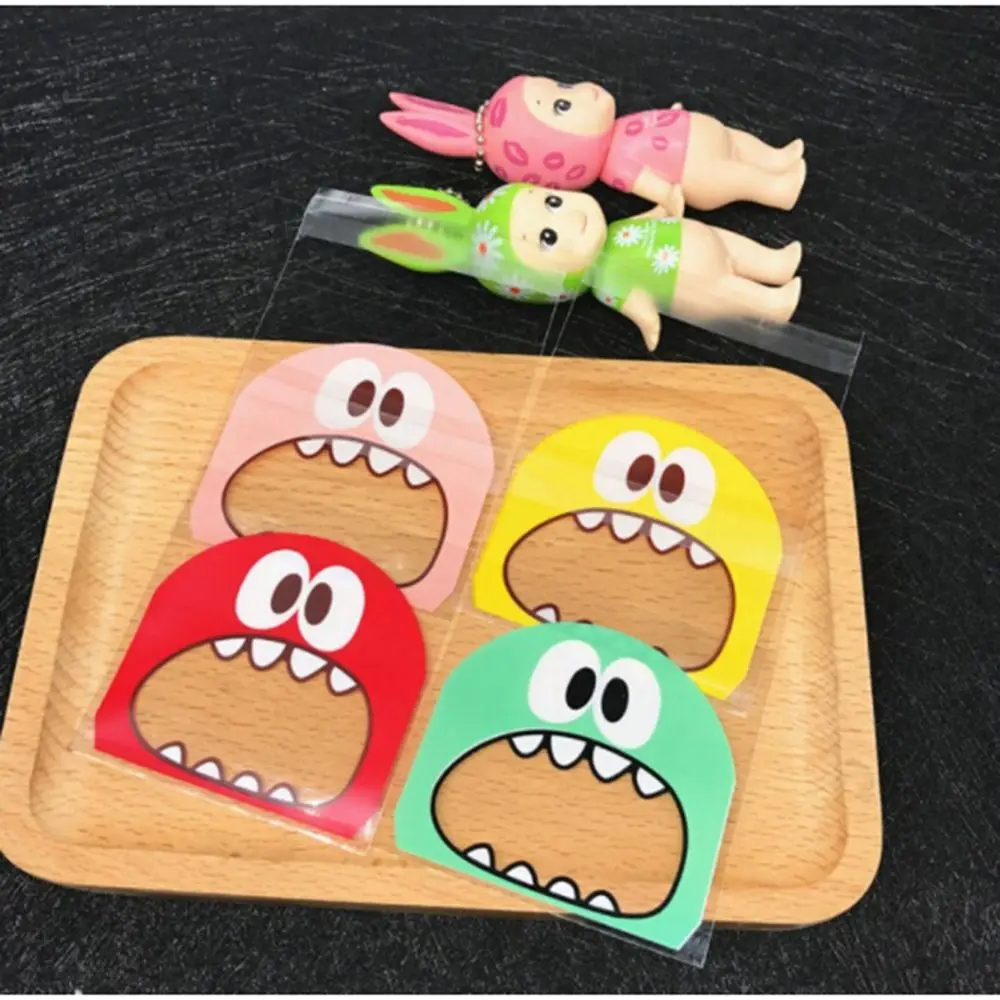 

100pcs OPP Cute Monster Sharp Teeth Wedding Cookie Candy decoration Packaging Bags Self Adhesive Seal Christmas Gift Bag Baking