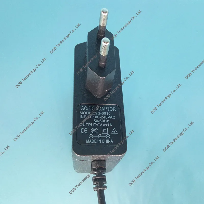 10 шт./лот Высокое качество AC/постоянный ток 9V 1A коммутации Питание адаптер обратной полярности отрицательный снаружи ЕС plug 5,5*2,1 мм 5,5*2,5 мм