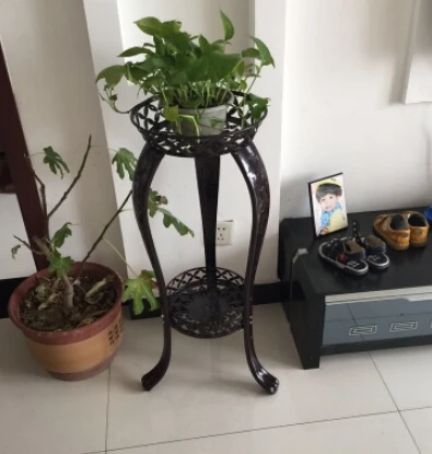 Wrought iron flower. The indoor floor balcony bracketplant jardiniere