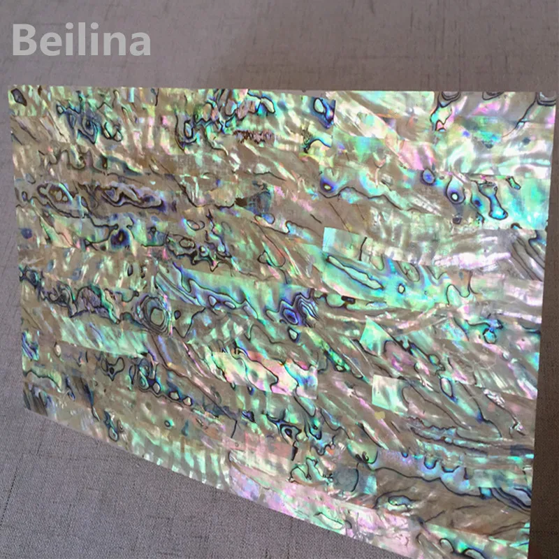 

A grade New Zealand paua abalone shell laminate sheet for decoration materials and wood inlay shell size240/140mm