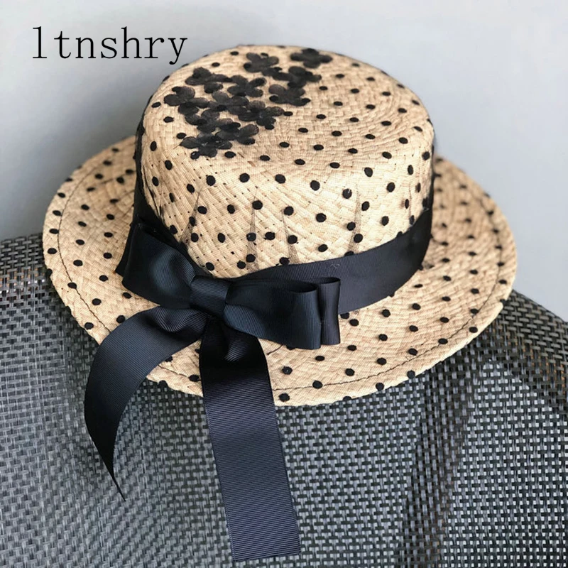 

2019 Raffia hat Black ribbon female version of the hat spring and summer sea level top hat bow seaside holiday wild net sun hat
