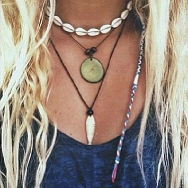 NK142 بوهيميا بوهو البحر Cowrie شل المختنق قلادة النساء حبل الطبيعي شل مجوهرات الشاطئ Chocker بسيطة Neckless للفتيات NK142 بوهيميا بوهو البحر Cowrie شل المختنق قلادة النساء حبل الطبيعي شل مجوهرات الشاطئ Chocker بسيطة Neckless للفتيات