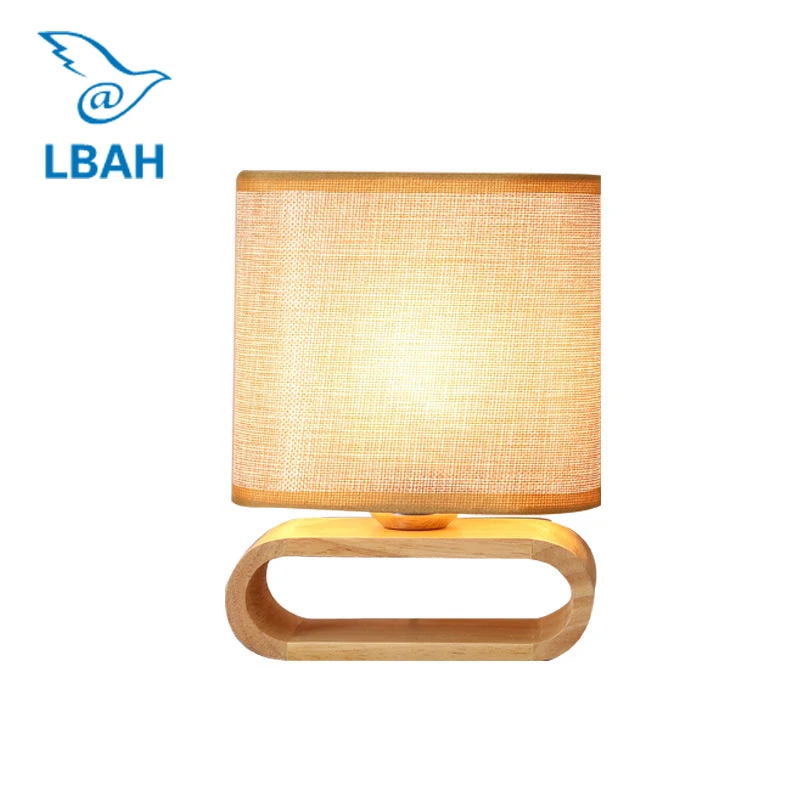 

Simple modern Japanese original ligneous lanterns bedroom head bed decorates the led cloth art desk lamp