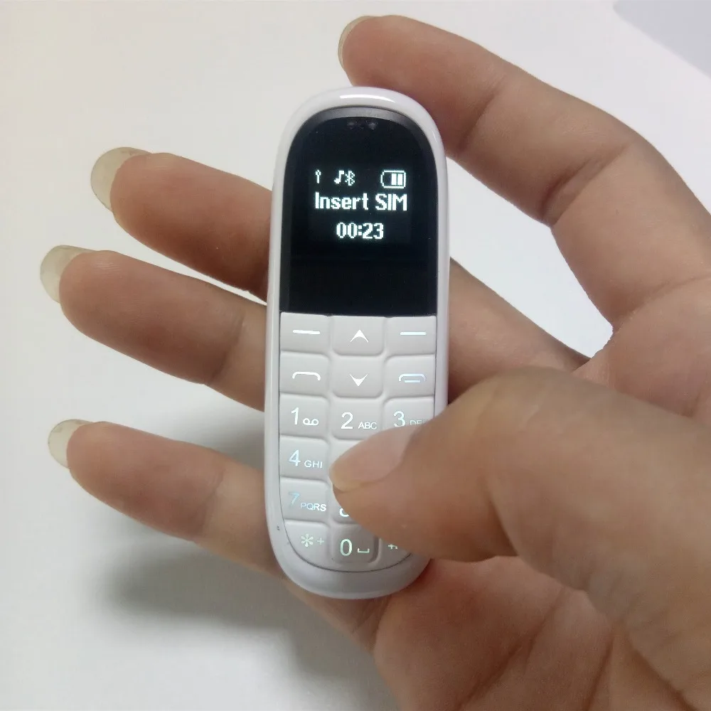 Оригинальный AEKU KK1 Bluetooth Dialer Mini Cute мобильный телефон 0 66 ''Magic Voice 330mAh 1 SIM карта