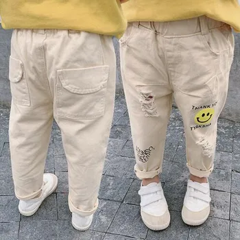 

2019 Fashion Autumn Baby Boys Girls Denim Pants Children Kids Broken Hole Jeans Big Smile Casual Jeans For Girls