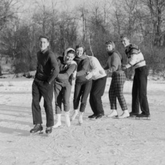 Group of friends ice-skating Poster Print (18 x 24)