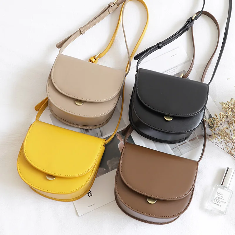 

Korean version of a small design single shoulder small bag simple retro semi-circular saddle bag fashion slant slant slant mini