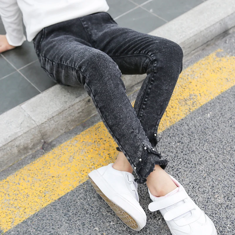 

Girls jeans 2019 new spring and autumn thin wear Korean version of slim fit elastic feet western style children's pants