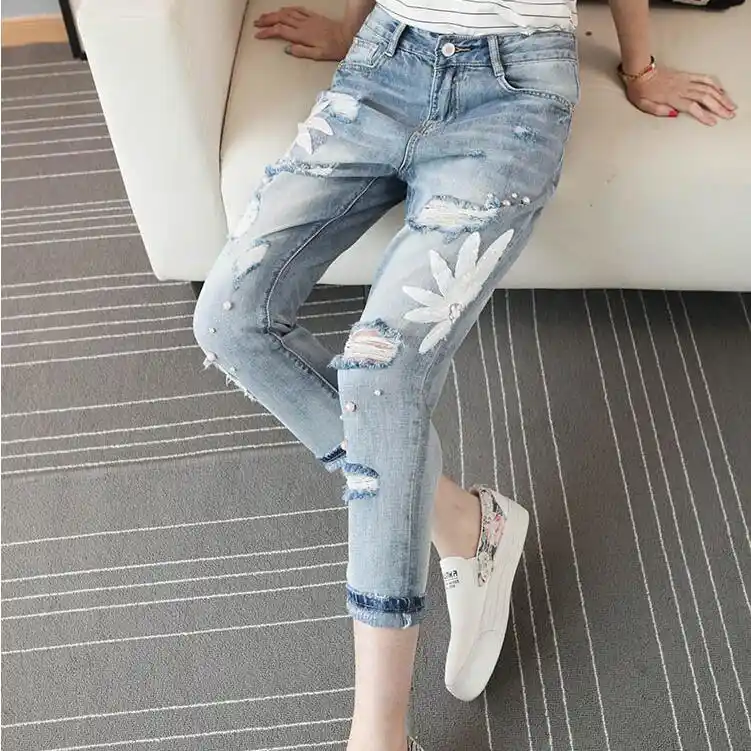 three quarter ripped jeans