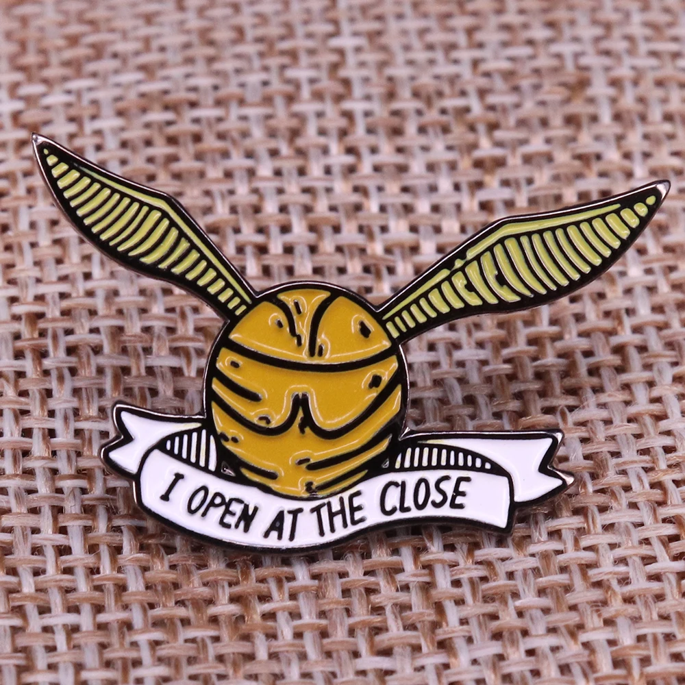 

Snitch I open at the close Pin FOILED Wizards and Witches Badge