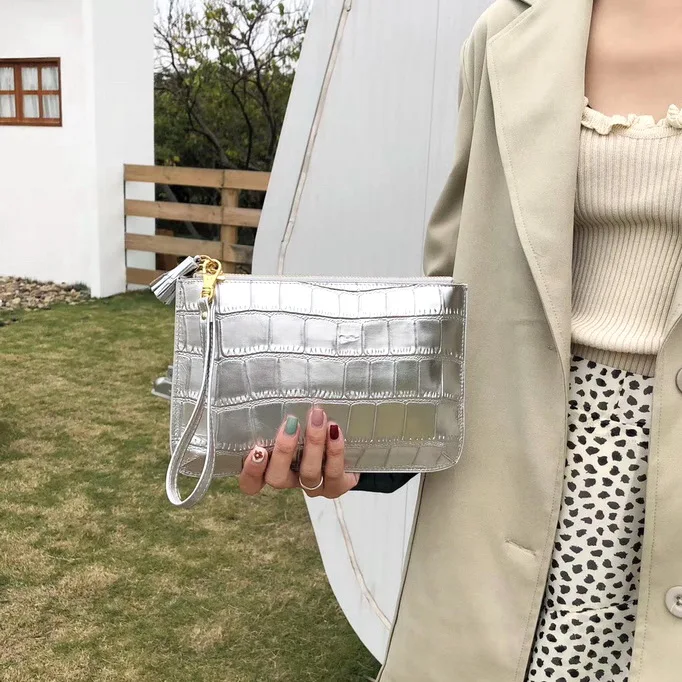 

Clutch bag female bag European station new 2019 fashion large capacity leather hand bag female handcuffs mobile phone purse
