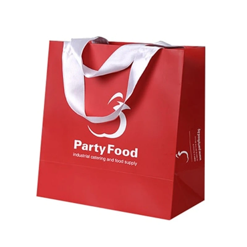 red paper bag with silver handle