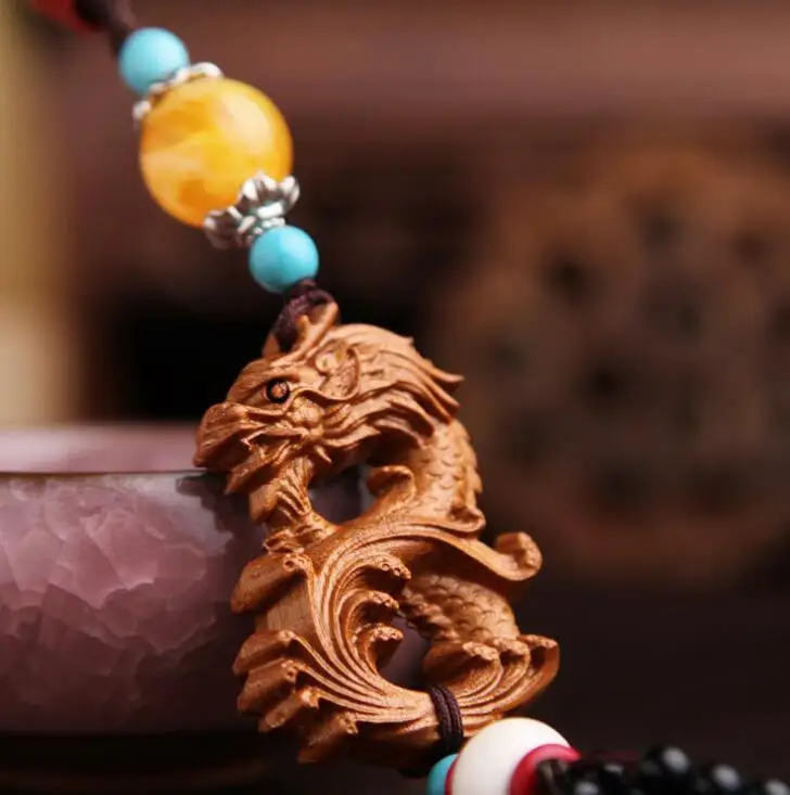 

Chinese Peach Wood Carved Animal Eight Shape Dragon Exquisite Car Key Pendant Bag Pendant