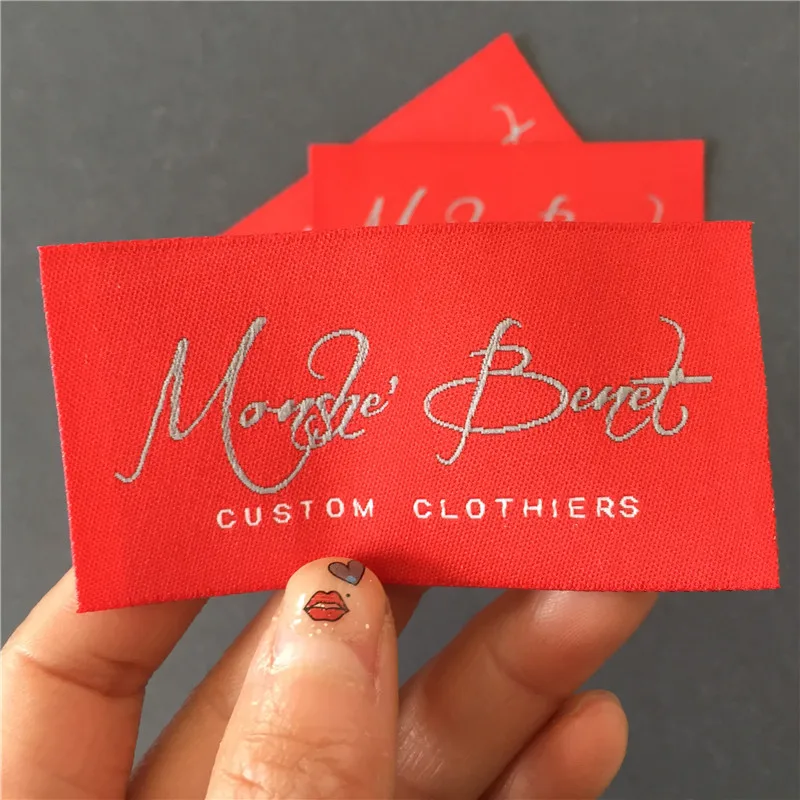 

Customized 4*7.8cm Thick Cloth Straight Cutting Garment Woven Labels in Red Background with Grey Name and white letters