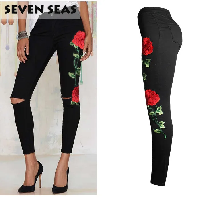 black jeans with embroidered roses