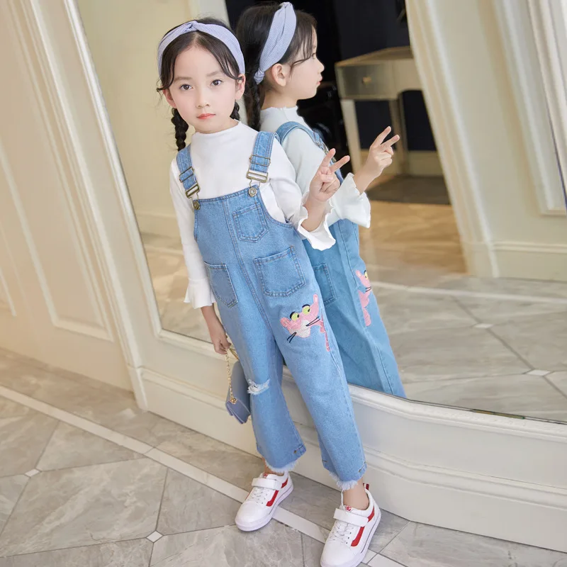 overalls and white shirt
