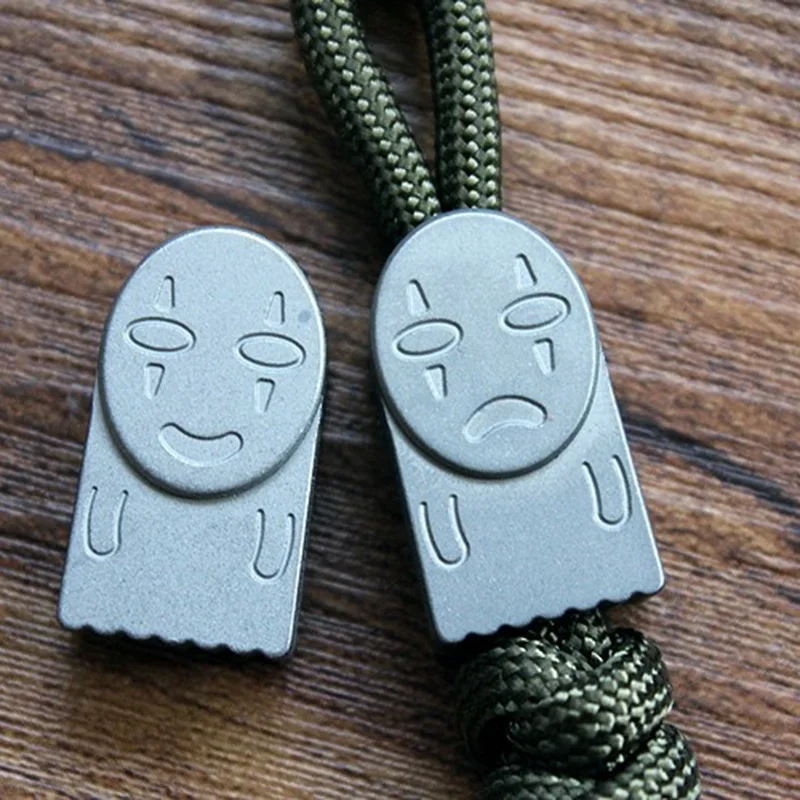 Sprited-Away-No-Face-Man-Titanium-Knife-Beads-Pendant-Hanging-Buckle-EDC-Umbrella-Rope-Pendant-Paracord (2)