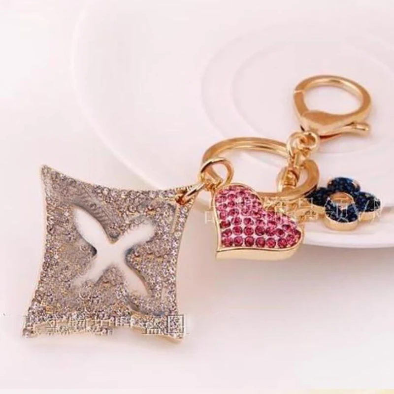 

Trendy High-quality Full Rhinestones Clover Lock Bag&Car Key Chain for Women and Men Wholesale Retail
