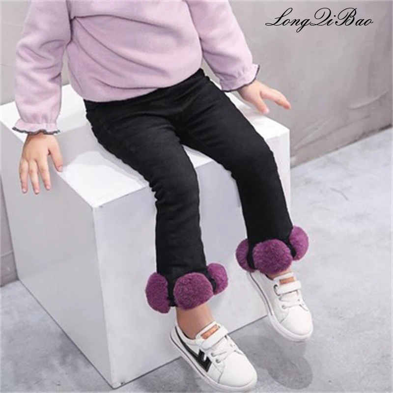 

Children's pants 2018 winter new children's clothing girls big hair ball black jeans baby thick pants trousers