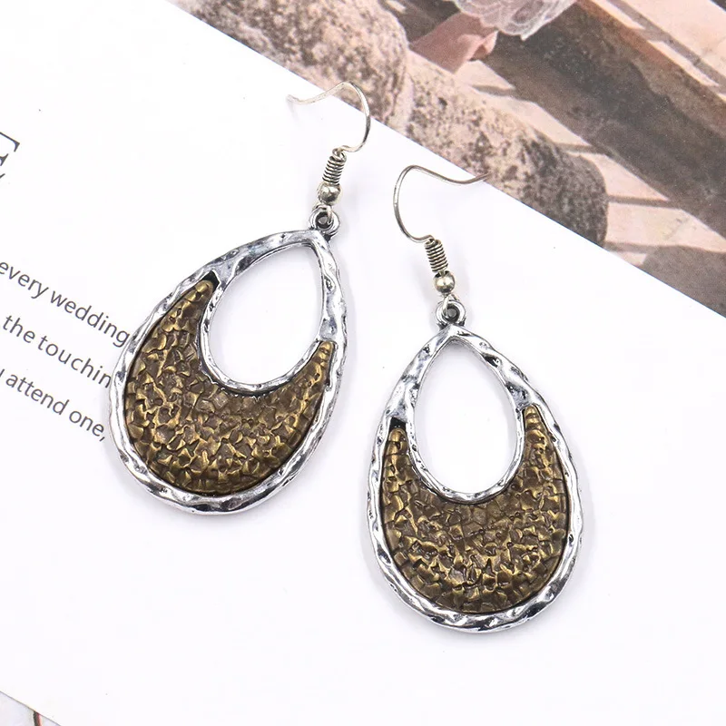 

2019 retro new earrings geometric hollow drop shape two-color die-cast metal engraving pattern pendant women's alloy earrings