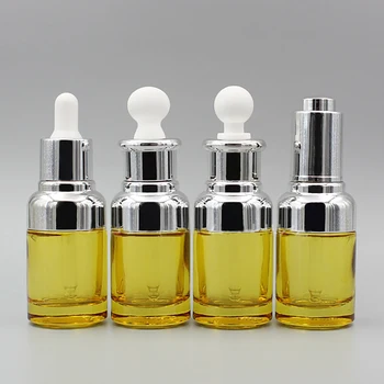 

Empty 30ml yellow glass oils bottle with gold or silver dropper, 1oz perfume container