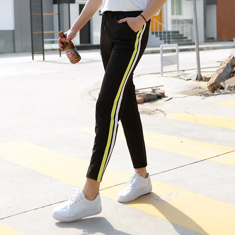 black pants with yellow side stripe