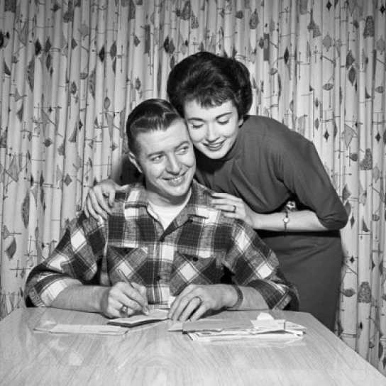 Young couple counting bills Poster Print (24 x 36)