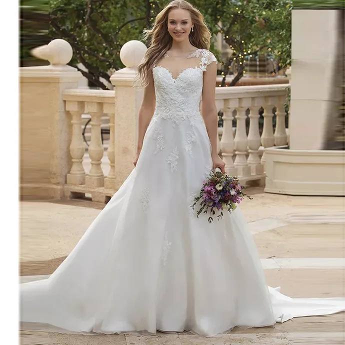 

Elegant Princess Boho A Line Wedding Dress Sheer O Neck Illusion Back Cap Sleeve Appliqued Lace Train Bridal Gown Free Shipping
